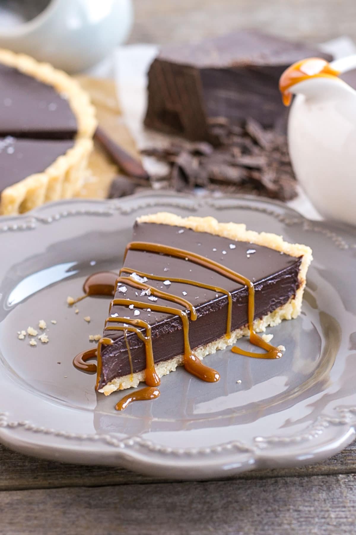 Slice on a plate with caramel drizzle.