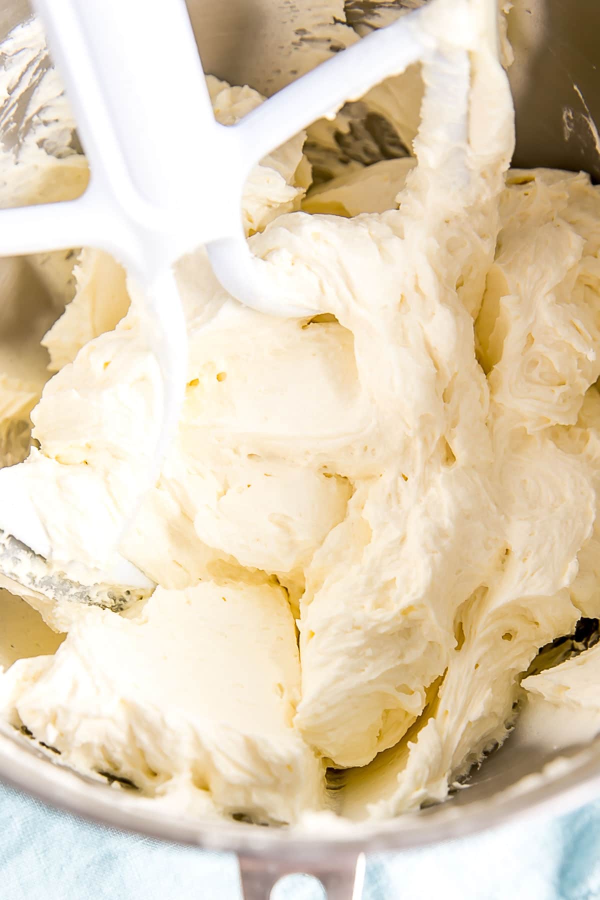 Ermine Frosting (also known as flour buttercream or heritage frosting) is an easy and delicious buttercream made with flour, sugar, milk, and butter. | livforcake.com Light and fluffy buttercream in the bowl of a stand mixer.