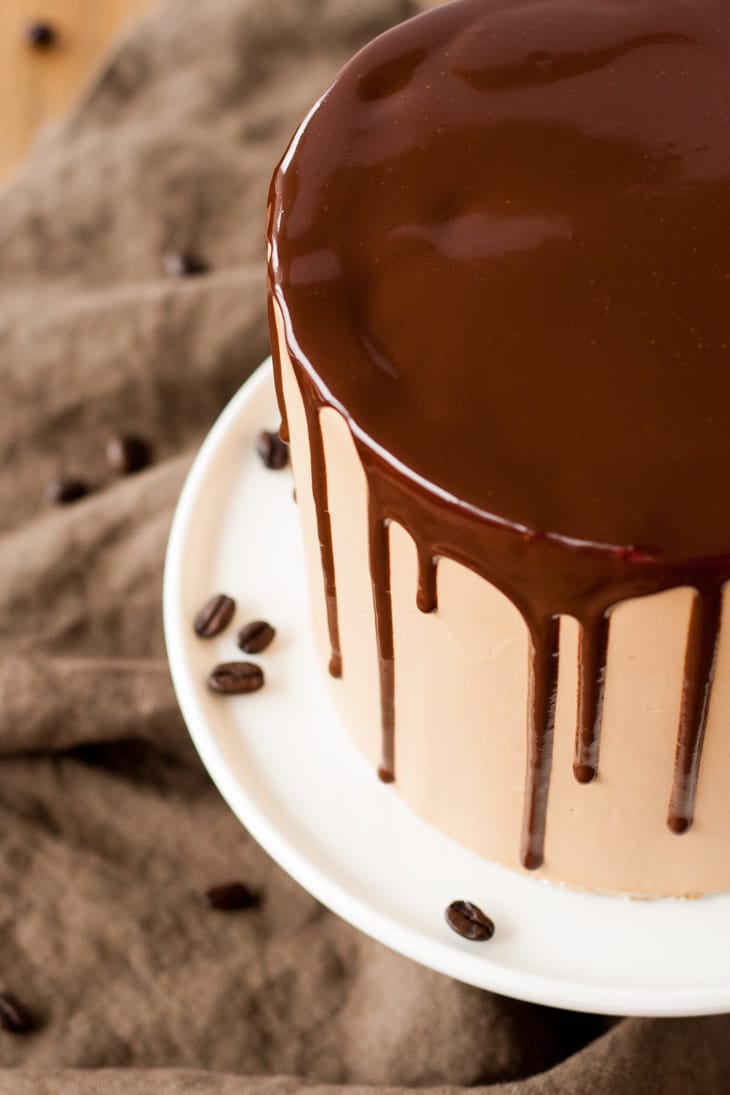 Mocha Cake! A rich dark chocolate cake with a silky mocha swiss meringue buttercream. | livforcake.com Ganache drip on a mocha cake