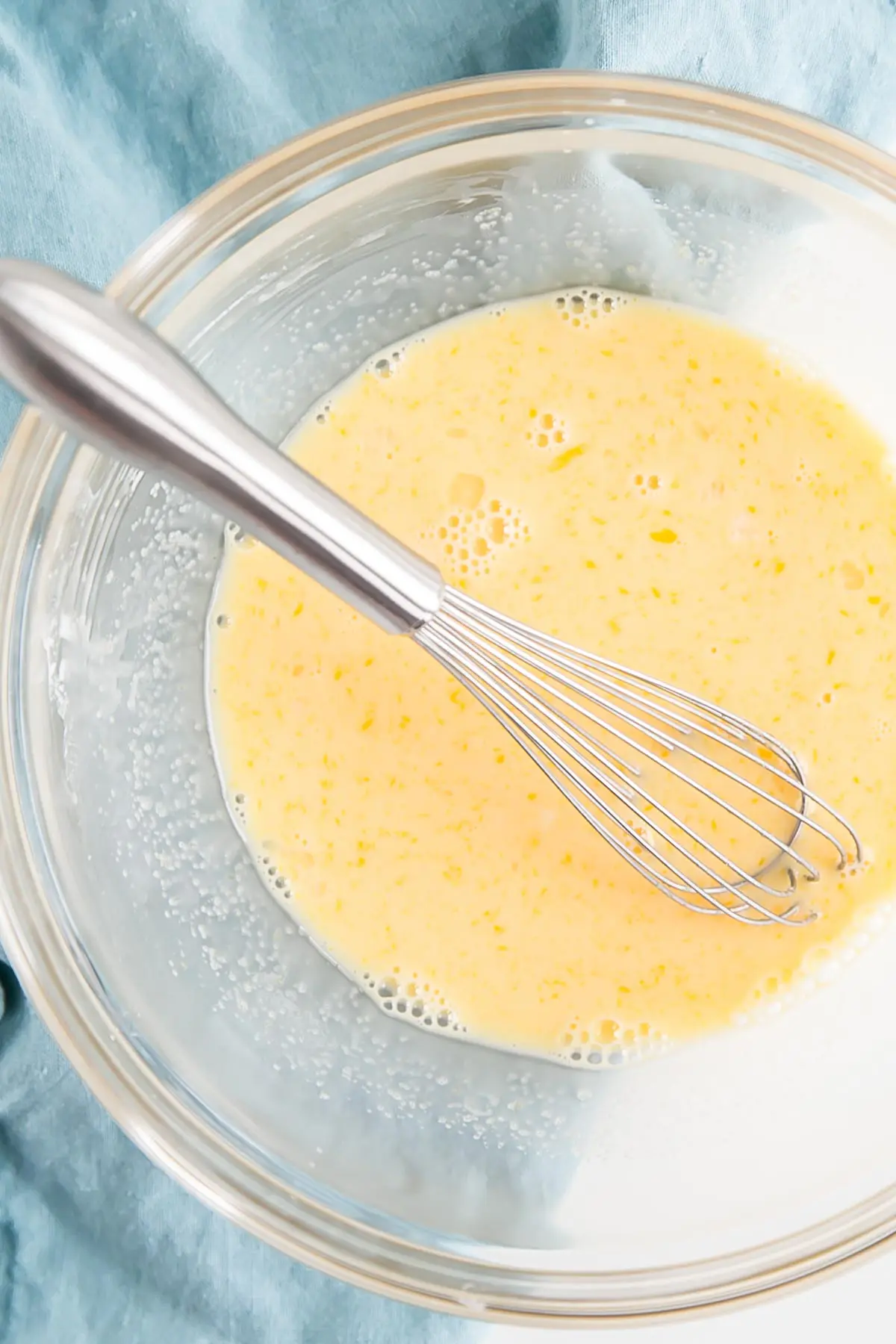 This easy Pastry Cream (Creme Patissiere) recipe is simple and delicious. A rich and creamy vanilla custard you can use in a variety of decadent desserts. | livforcake.com Eggs, milk, and cornstarch whisked together.