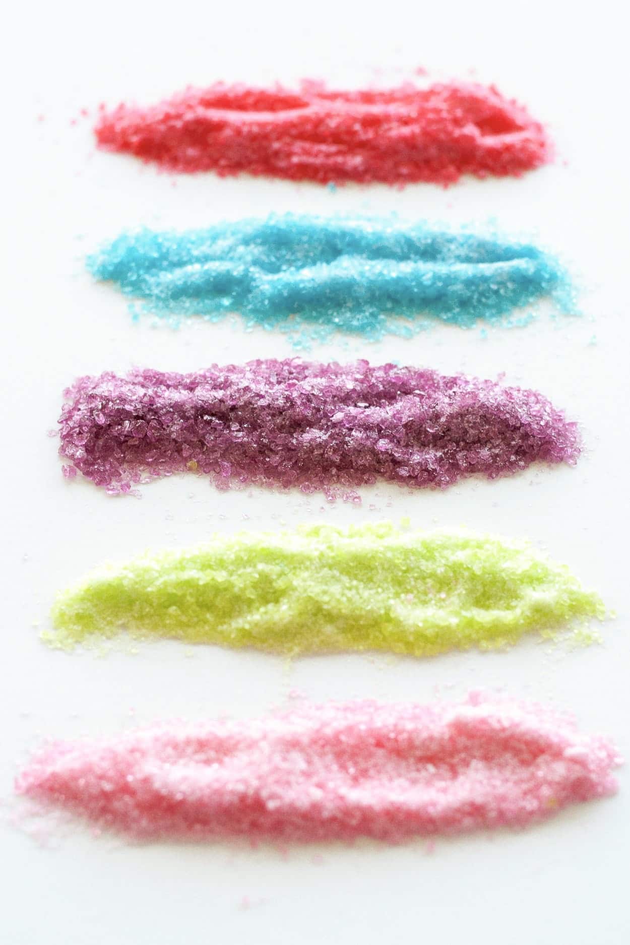 Learn how to make stunning stained glass cookies with this detailed tutorial! Perfect for holiday cookie exchanges or hanging on your tree. | livforcake.com Crushed candy in different colors